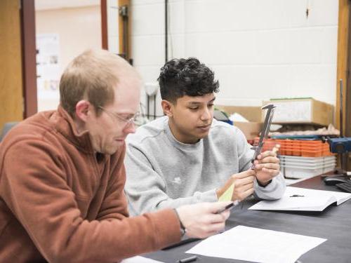 Physics student working on a lab experiment.